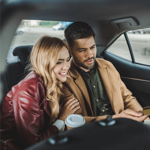 couple sitting in taxi